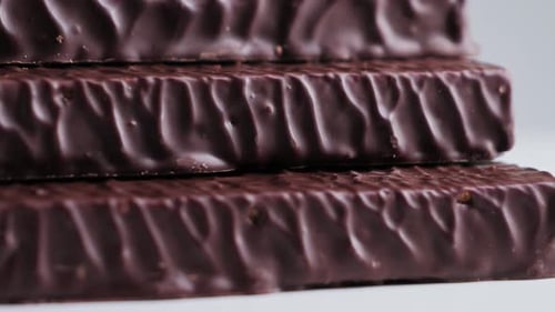 Delicious Chocolate Bars on a Rotating Surface Protein Bars Close Up Snack Before or After Workout