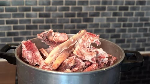 Frozen Bones Placed in Pot for Bone Broth