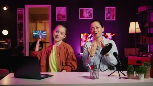 Enthusiastic Woman and Child Broadcasting from Home