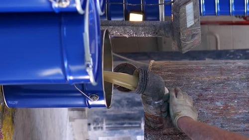 Pouring Beige Substance From Container