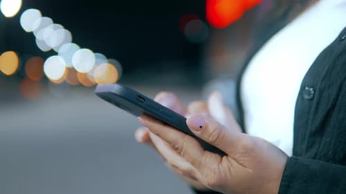 Person Using Cellphone at Night