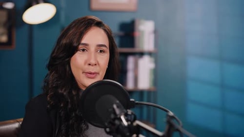 Portrait of Pretty Brunette Woman Conducts Podcast in Audio Studio
