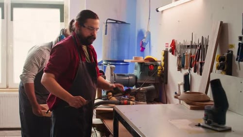 Carpentry Men Working on Wood in Workshop
