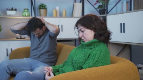 Man and Woman Having Difficult Conversation at Home