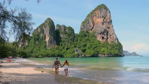 Strolling Hand in Hand Along the Beautiful Beaches of Railay Beach Krabi Thailand on a Sunny Day
