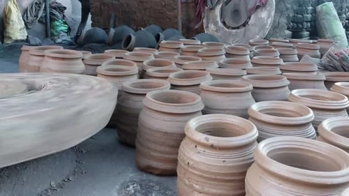 Potter making a clay pot or mitti ka mataka on the pottery wheel at the village