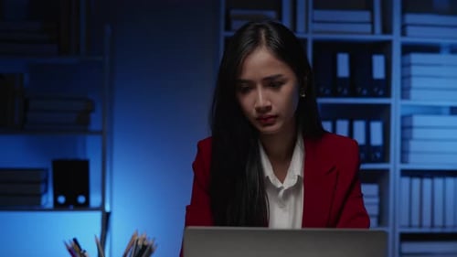 Businesswoman seriously stressed working overtime headache and eye ache due to office syndrome