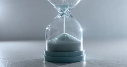 Sand Falling in Hourglass Close Up