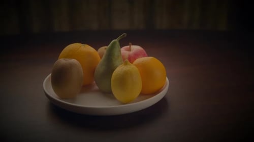 Plate of Fresh Fruit on Dark Table