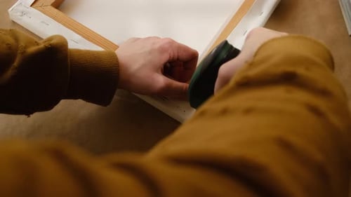 Stapling White Canvas onto a Wood Frame