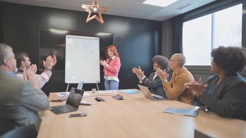 Business Team Meeting Applauding Presentation in Conference Room