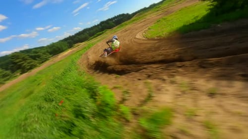 Motocross Rider Racing on Dirt Track, Aerial View