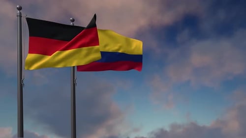 Flags of Germany and Colombia Waving in the Wind