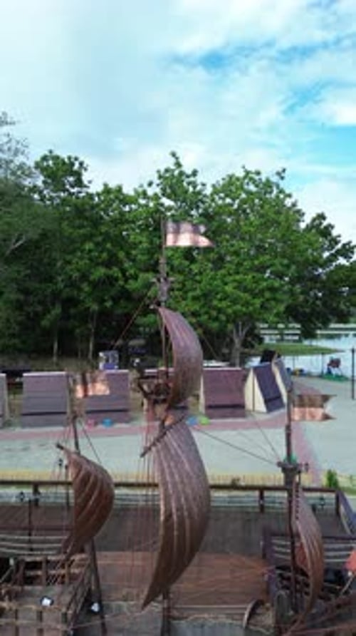 Vertical Drone Footage of the Ship Monument on Perintis Lake in the Morning