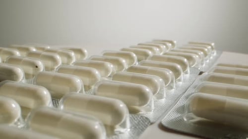 Pills and Vitamins Macro Close Up View of Womans Hands Holding Plenty of Different Drugs Painkillers