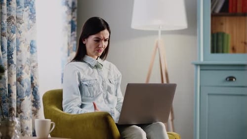 A Young Business Woman Working at Home Remote Job Employee Irritated Businesswoman Close Notebook