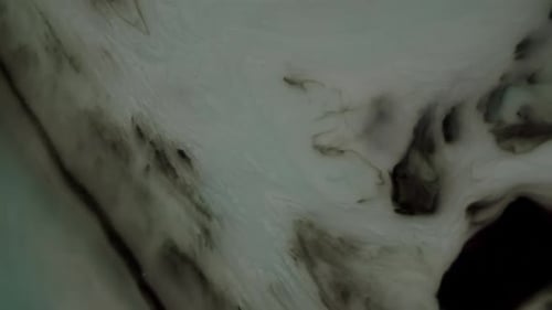 Surface of gas planet with whirlwinds and hurricanes is actually ink experiment shot top down. Cosmi