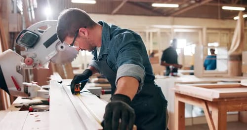 Woodwork, carpenter and man with tape measure in workshop for furniture manufacturing