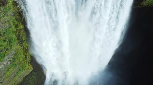 Epic Aerial Flight Over Skogafoss Waterfall in Iceland Pure Nature and Huge Mountain River at Summer