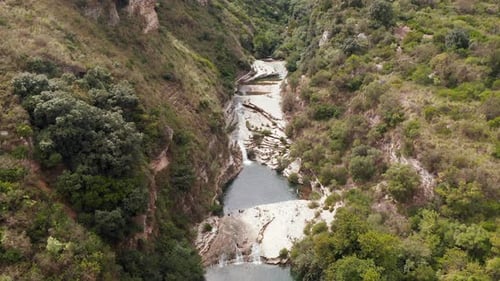 Aerial View Of Waterfall In Laghetti Cavagrande And Laghetti d'Avola In Cavagrande del Cassibile Can