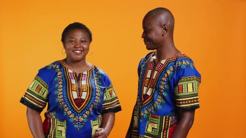 Man and Woman Smiling and Giving Thumbs Up