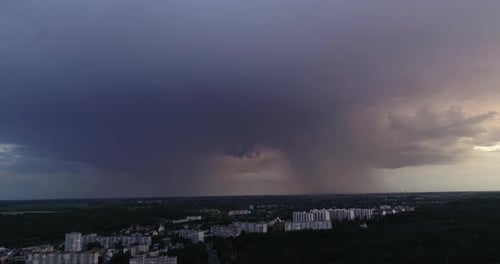 Thunder clouds over the city, aerial view