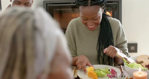 Friends Laughing Together at a Meal
