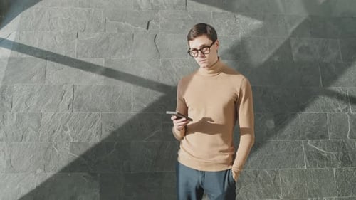 Young Businessman Using His Smartphone