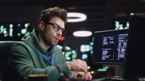 Tensed Coder Solving Problem in Dark Datacenter Closeup Tired Man Working Late