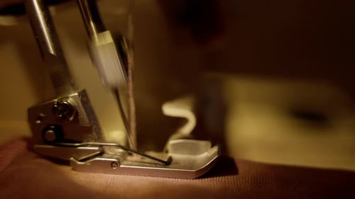 Sewing Machine Stitching Pink Fabric Close Up