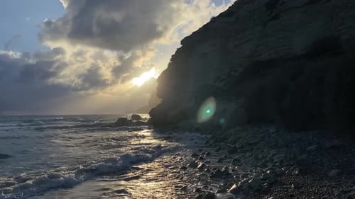 Dramatic Sunset at the Beach with Rocks
