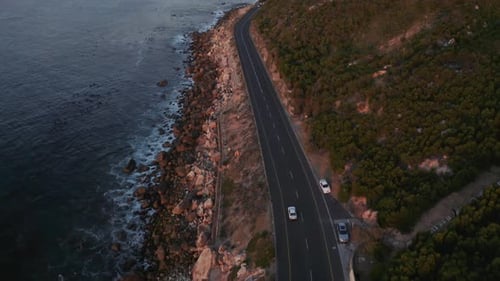 Aerial Car Driving Along Coast, Pan Up Tracking Forward 4K