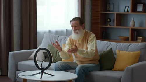 Senior Man Vlogging on Smartphone