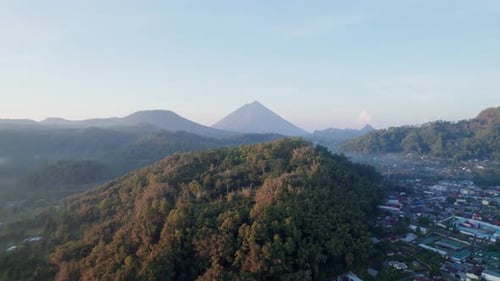 Aerial view of Bajawa village with Mount Inerie volcano at sunrise