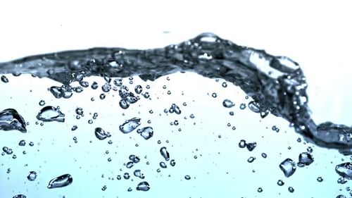 Super Slow Motion Blue Water Waves with Air Bubbles Filmed on a Highspeed Camera at 1000 Fps