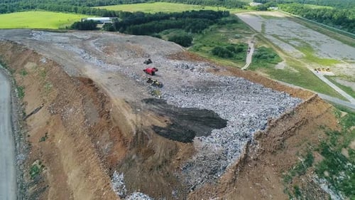 Aerial View of Large Garbage Landfill Trash Dump Flocks of Birds Circling Over the Garbage Dump