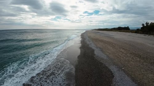 Ocean Waves On Cloudy Day