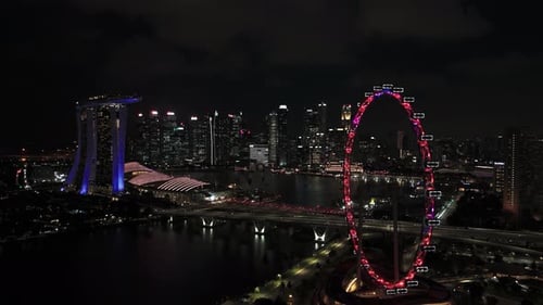 Immer noch Drohnenblick bei Nacht auf Marina Bay Sands, Singapur-Flyer und Stadtbild