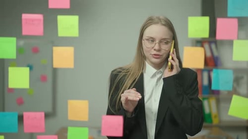 Portrait of Corporate Leader in Office Planning Project on Notes Business Woman Talking on