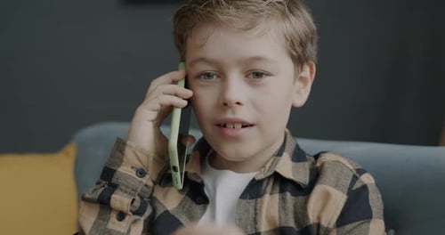 Child Talking on Phone in Living Room