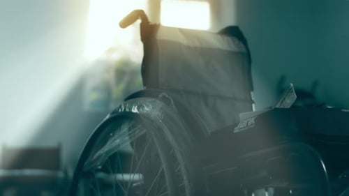 Row of Empty Wheelchairs in Hospital Waiting Room
