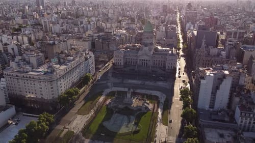 Palace of Argentine National Congress and cityscape at sunset, Buenos Aires. Aerial forward tilt-dow