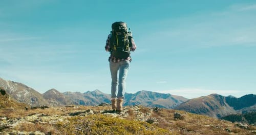 Traveler Explore New Horizons Walk on Mountain Top with Hike Backpack on Trip