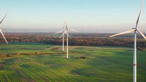 Shot of sustainable synergy of onshore wind turbines in agriculture, providing clean and renewable e