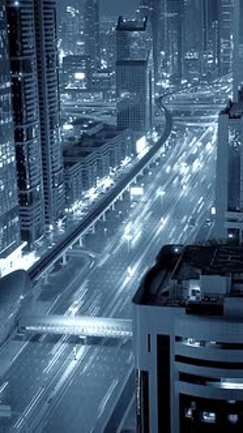 A Breathtaking Urban Night Landscape Showcasing Dynamic and Vivid Traffic Illuminated in Blue Tones