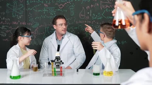 Excited Children Learn Science with Teacher in Lab