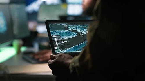 Person Holding Tablet With User Interface Inside