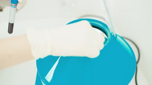 Loading Blood Samples into a Centrifuge Machine
