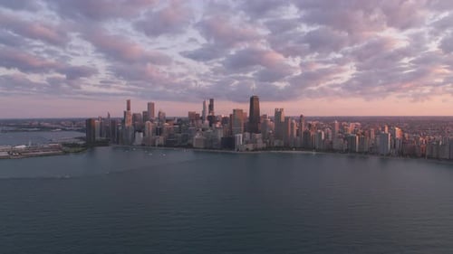 Chicago Illinois sunset aerial view over lake Michigan from helicopter