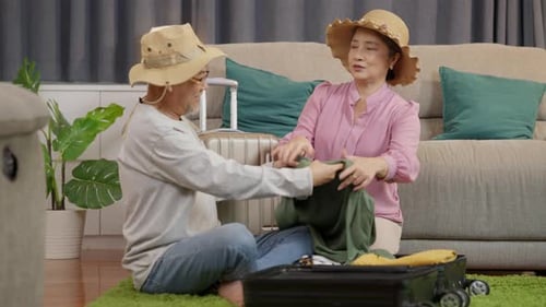Senior Women Packing Suitcase for Fun Adventure